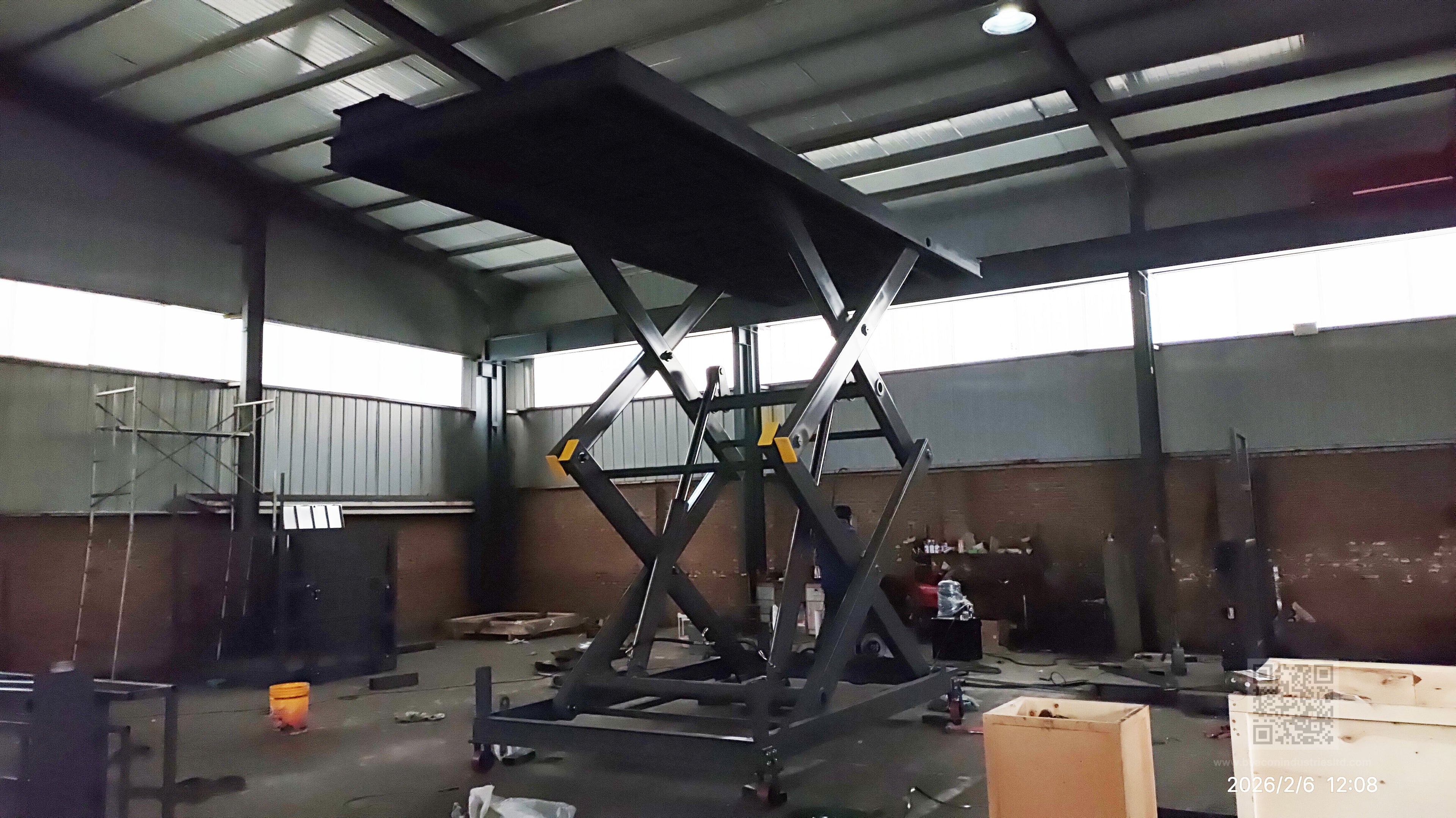 Industrial scissor lift hydraulic system detail — dual-layer scissor structure